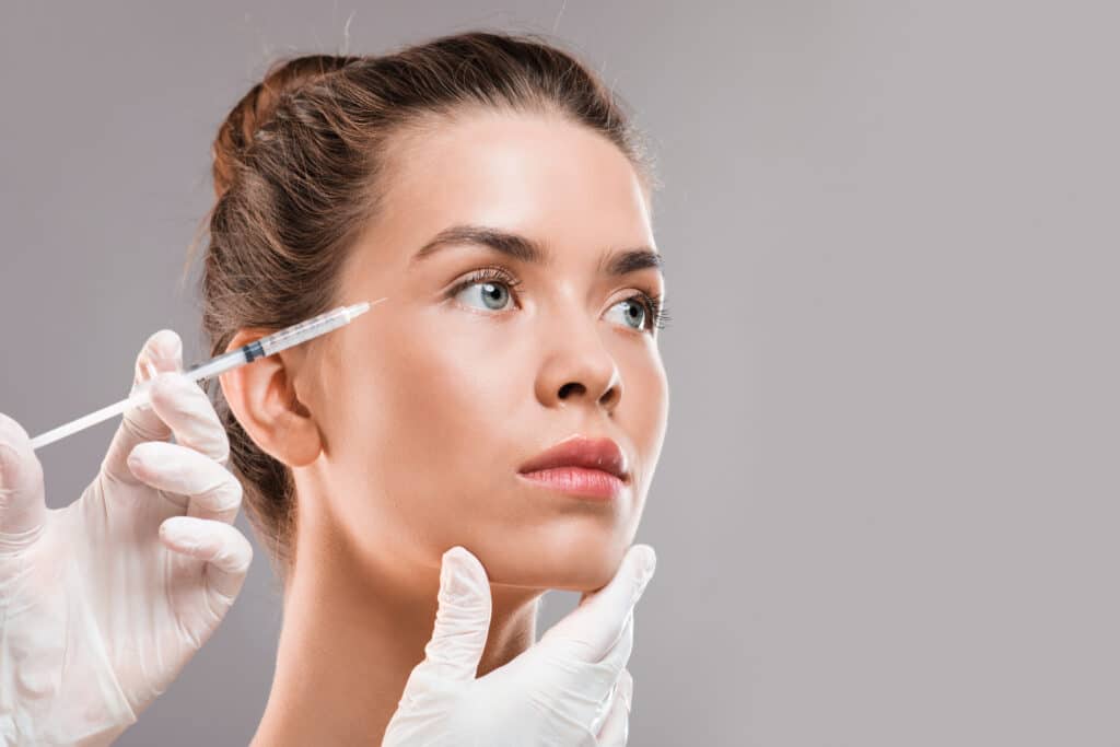 A woman getting a Xeomin® injection
