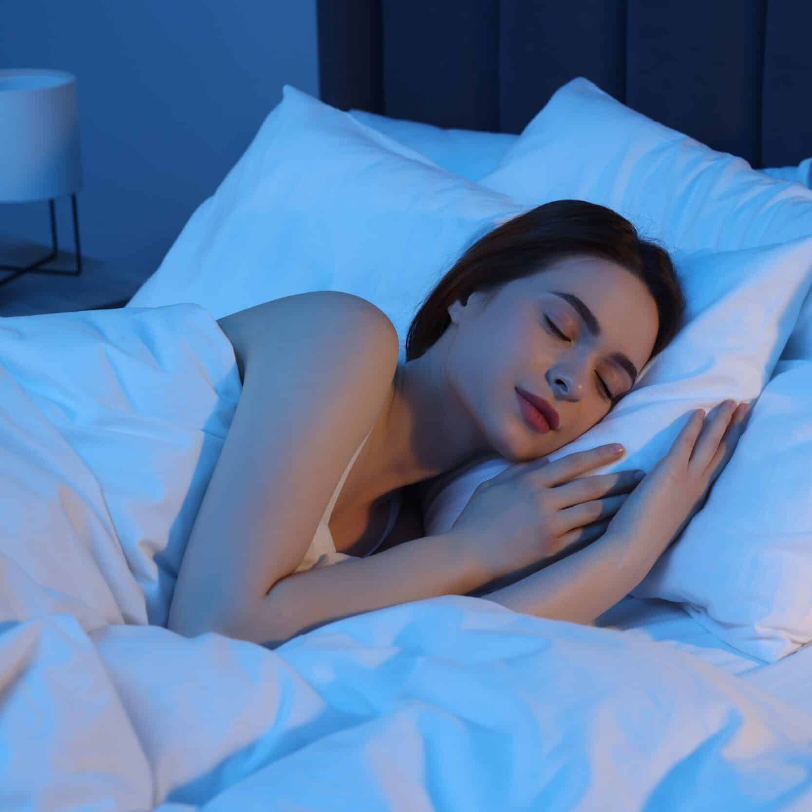 A woman sleeping after using sleep management peptides in Atlanta